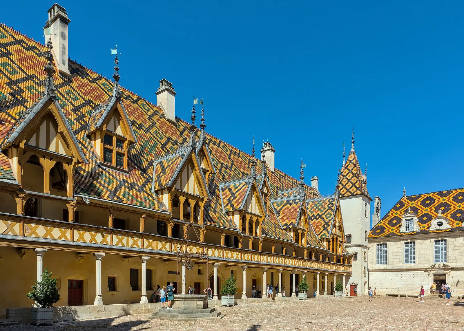 Courtyard of the Hôtel-Dieu in Beaune with its colourful glazed tile roof