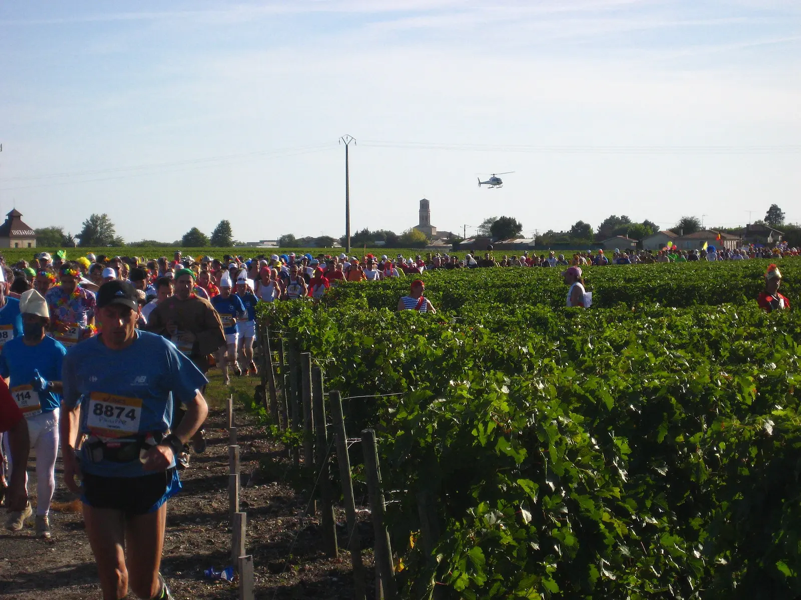 Runners passing through Medoc vineyards during the Marathon du Medoc