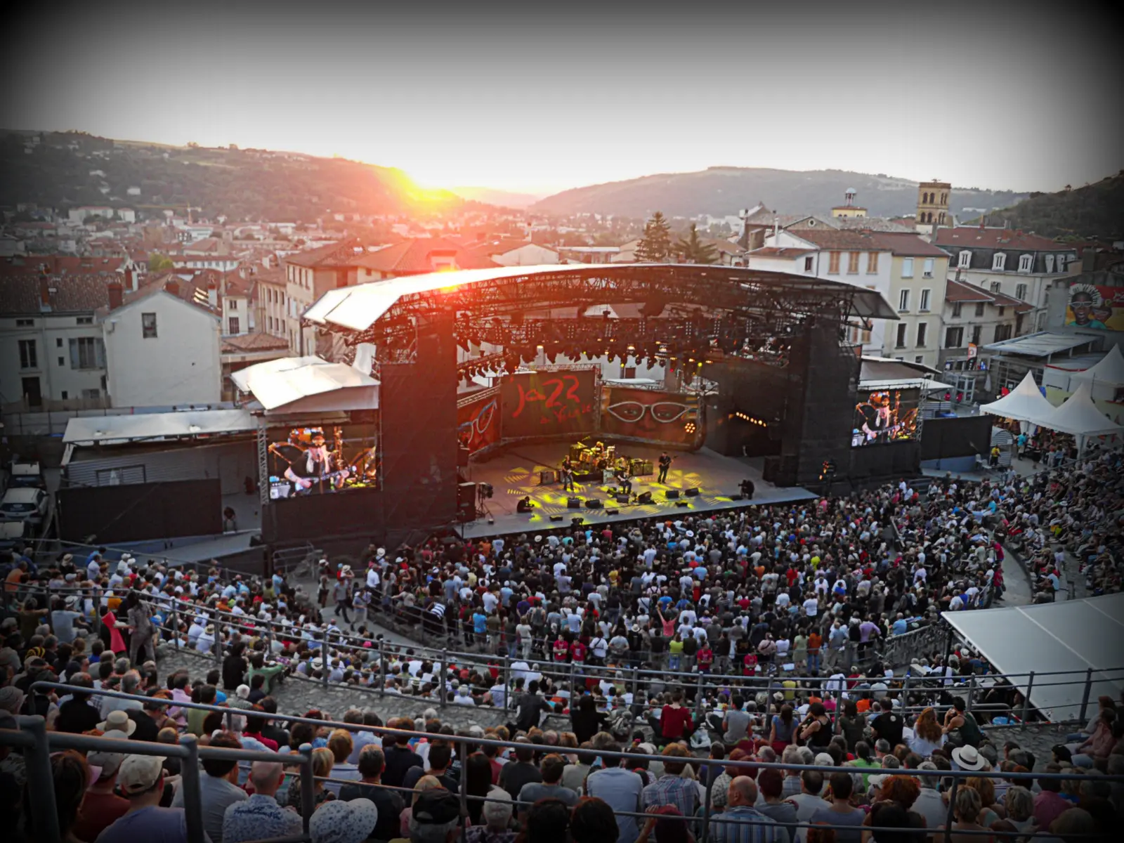 Crowd in the ancient theatre of Vienne at sunset during a Jazz a Vienne concert